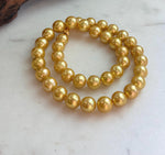 Large 10.1–11mm deep tea gold freshwater pearl necklace