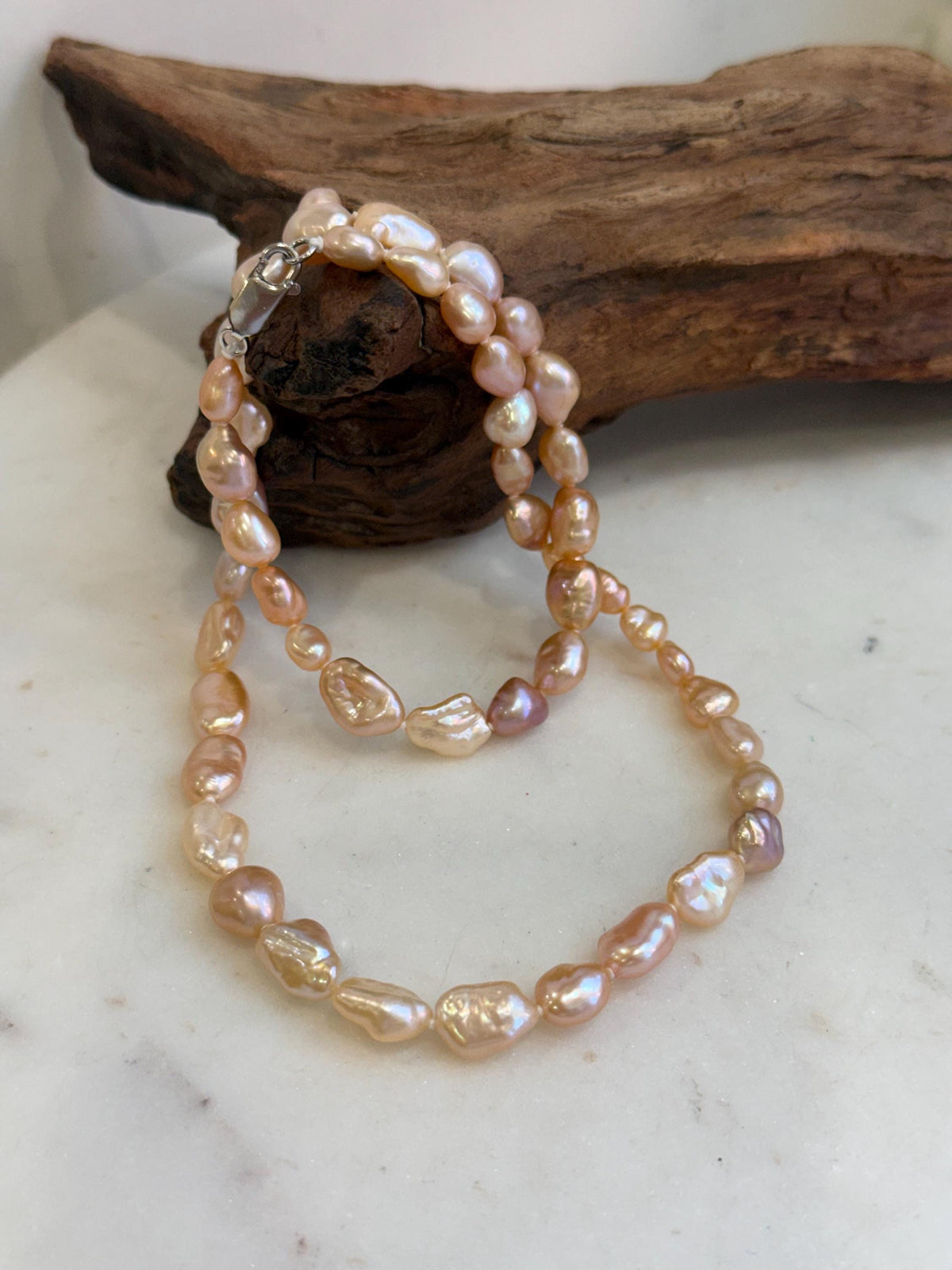 Elegant genuine freshwater Keshi pearl strand measuring approximately 19.7 inches long.