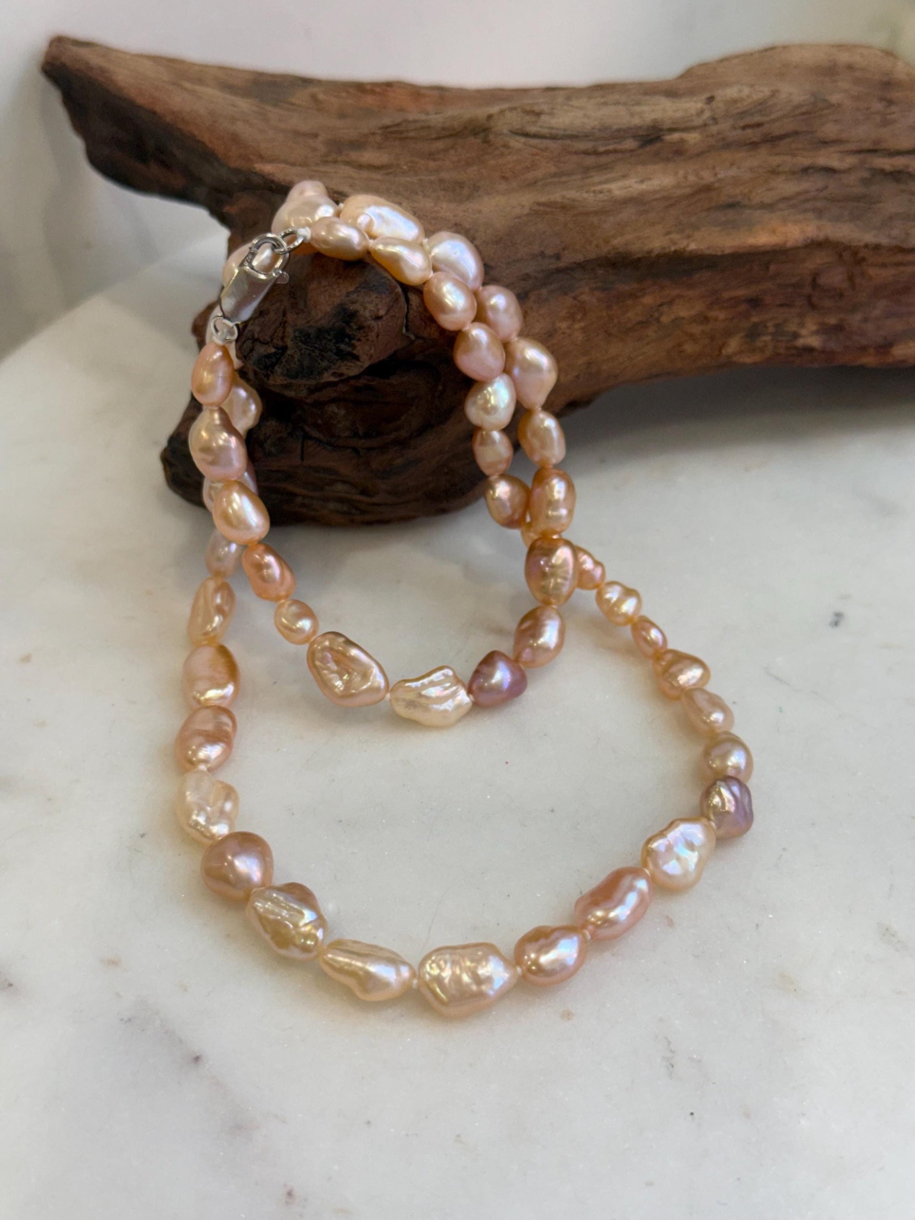 Elegant genuine freshwater Keshi pearl strand measuring approximately 19.7 inches long.