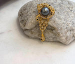 Close-up of 10.7mm Tahitian ocean pearl showing extreme mirror-like luster.