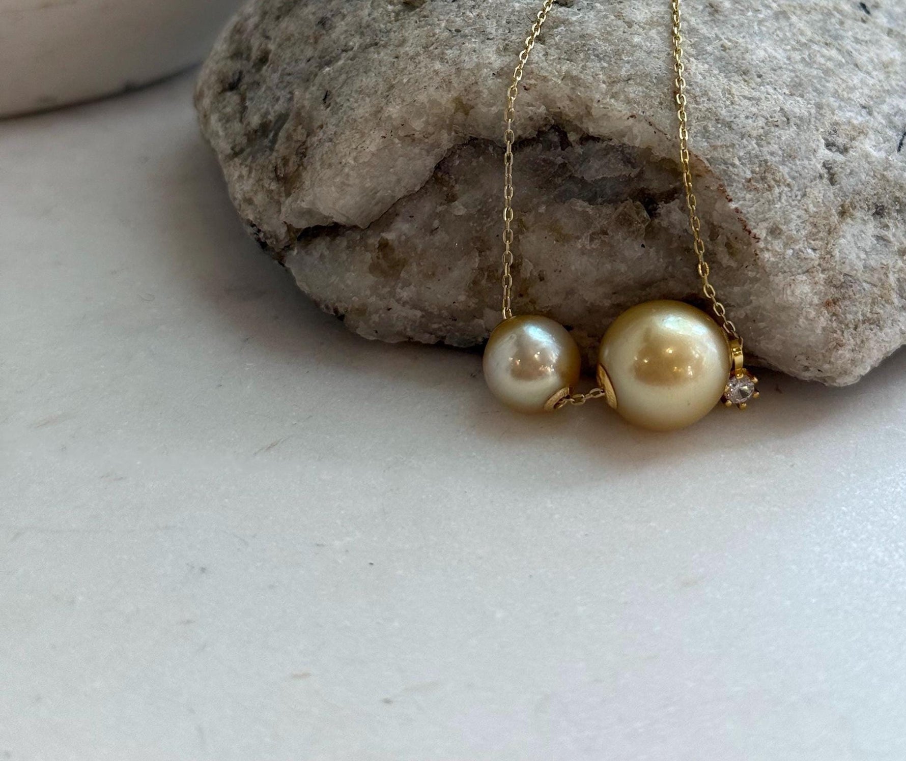 Two South Sea golden pearls floating necklace design