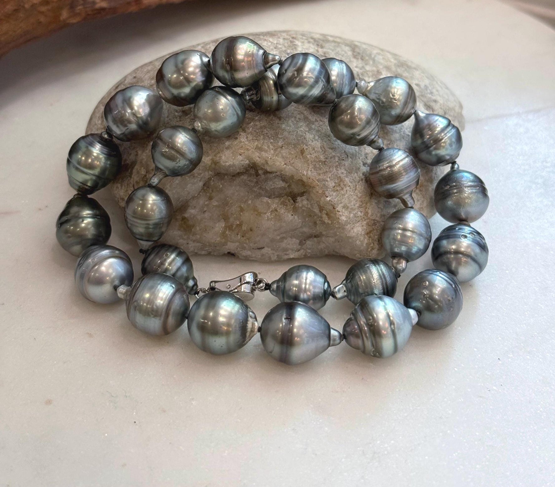 Genuine black pearl necklace hand knotted with sterling silver clasp