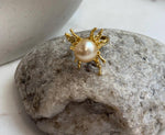 Genuine ocean pearl jewelry featuring a rich deep golden South Sea pearl in a feminine butterfly ring design.