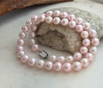 Luxury 44-pearl necklace featuring naturally beautiful pale pink freshwater pearls and sterling silver clasp.