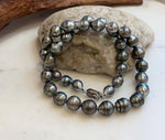 Genuine Tahitian saltwater pearls featuring rich platinum black tones