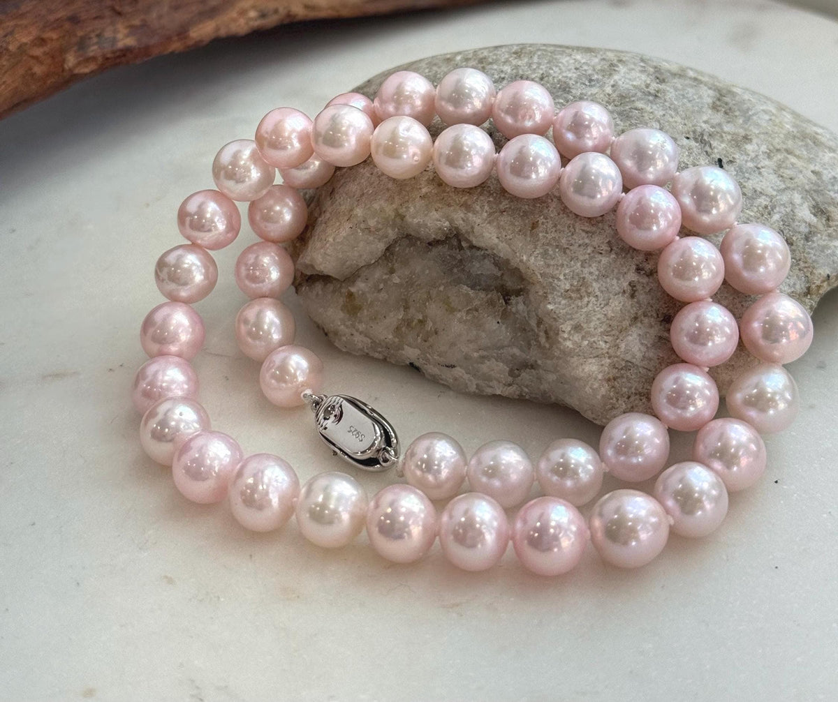 Elegant 17.8-inch genuine pearl necklace with 9–10mm pale pink pearls and extreme mirror luster.