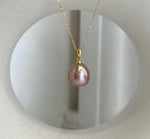 Elly’s 12.1mm Edison rose gold freshwater pearl pendant with extreme mirror luster.