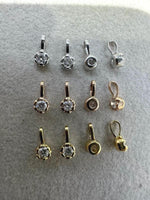 Moissanite charm size comparison featuring 0.05, 0.10, 0.20, 0.30 and 0.40 ct stones.