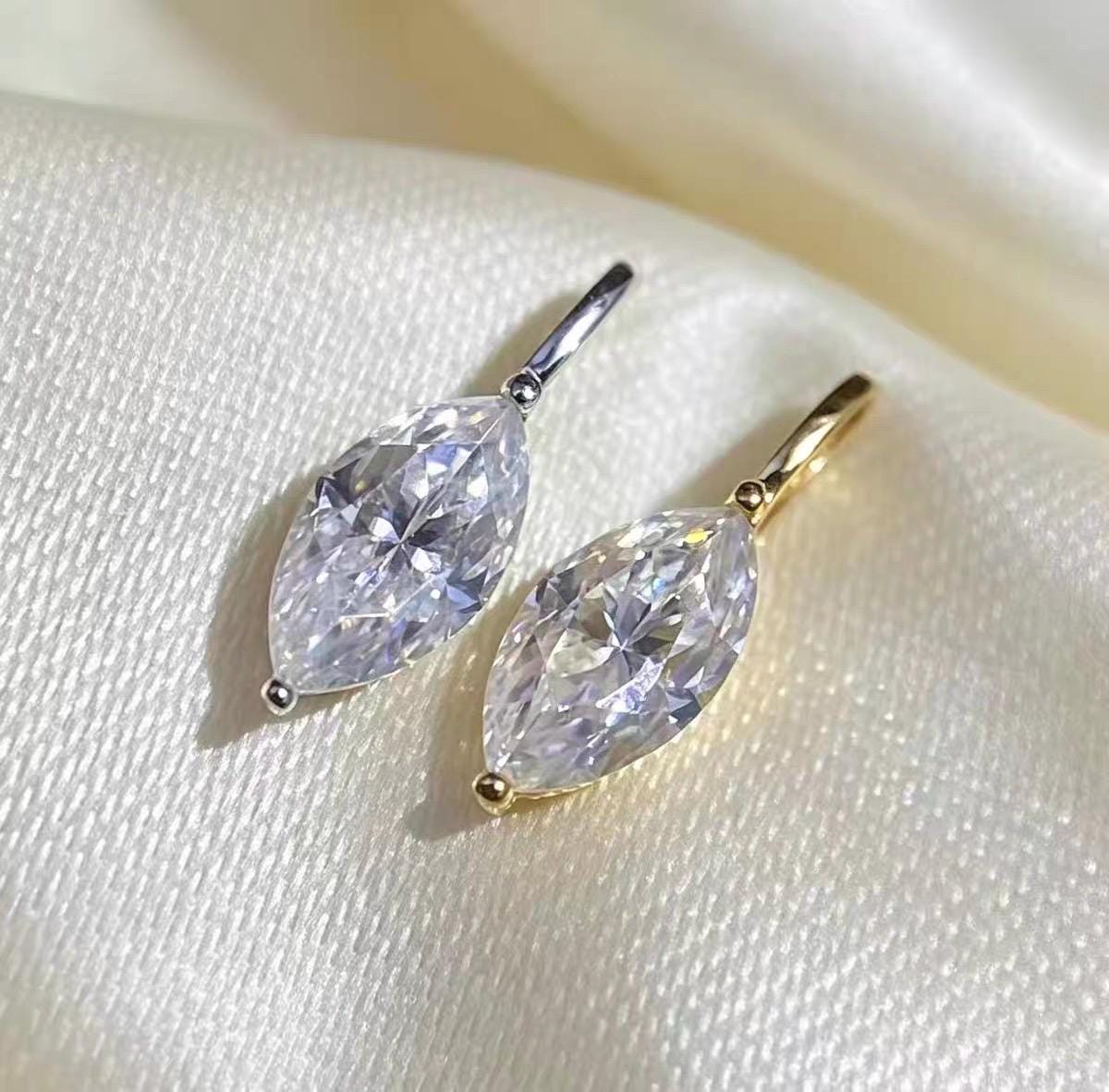 Elegant 18K gold marquise moissanite charm for necklace and pendant jewelry designs.