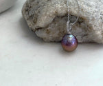 Genuine freshwater Edison pearl with intense mirror-like luster in an elegant pendant design.