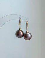 Rose gold green Edison pearl drop earrings with natural multicolor overtones and brilliant reflective shine.