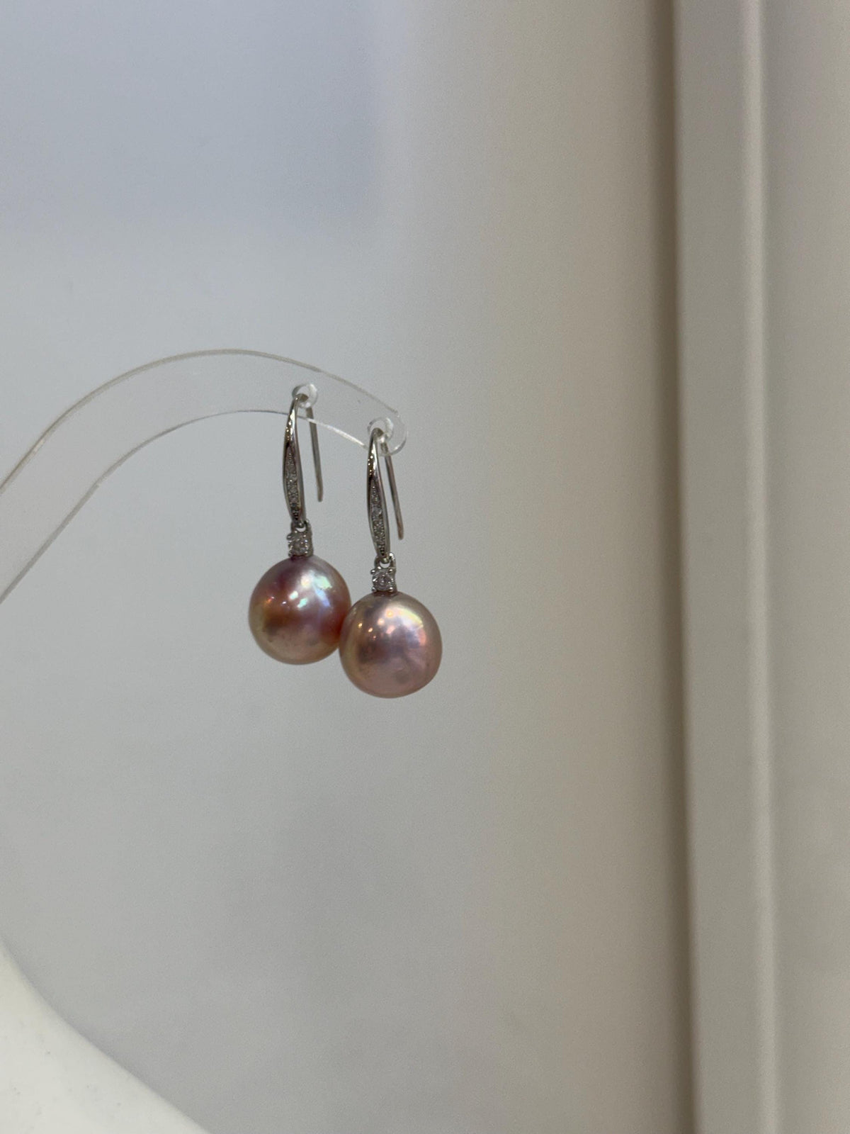 Luxury Edison pink gold pearl earrings with 12.2mm genuine freshwater pearls and extreme mirror luster.