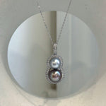 Luxury double Tahitian pearl necklace pendant with a modern gourd-inspired design.