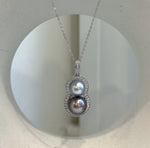 Minimalist S925 sterling silver pendant featuring two lustrous Tahitian ocean pearls.