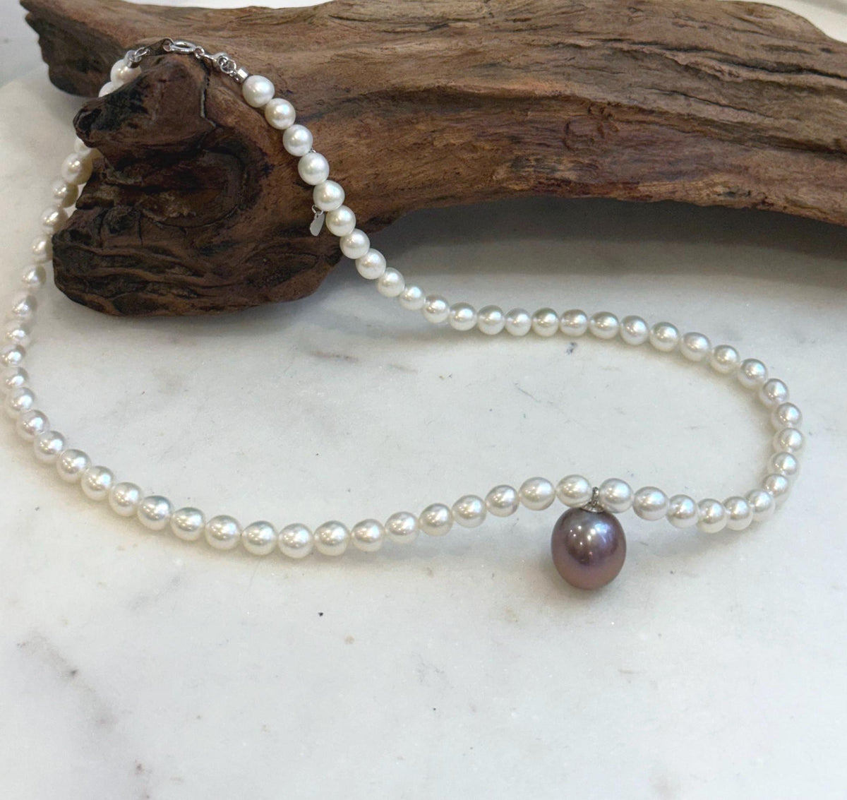 Purple Edison and white freshwater pearl necklace with mirror luster.