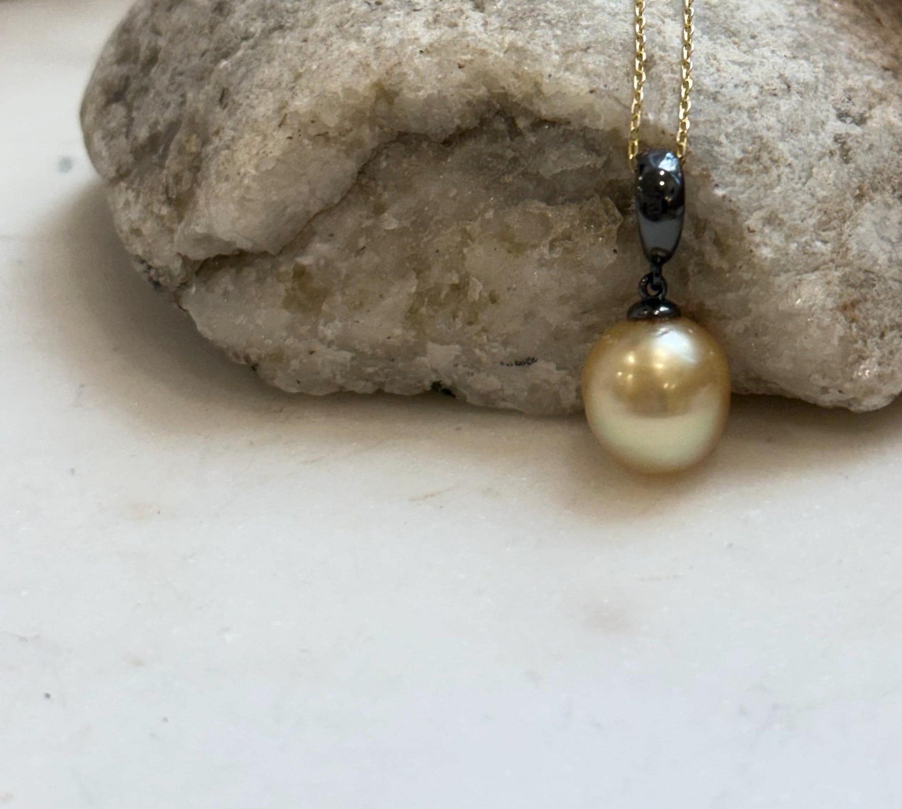 Natural saltwater pearl pendant featuring a large 11.2mm deep tea gold South Sea pearl.