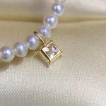 Clear square moissanite jewelry charm featuring a classic princess cut and solid 18K gold setting.
