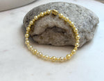 Small golden freshwater pearls creating a classic and feminine bracelet design.