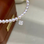 Princess cut diamond shape clear moissanite charm crafted in Au750 solid 18K gold with brilliant sparkle.