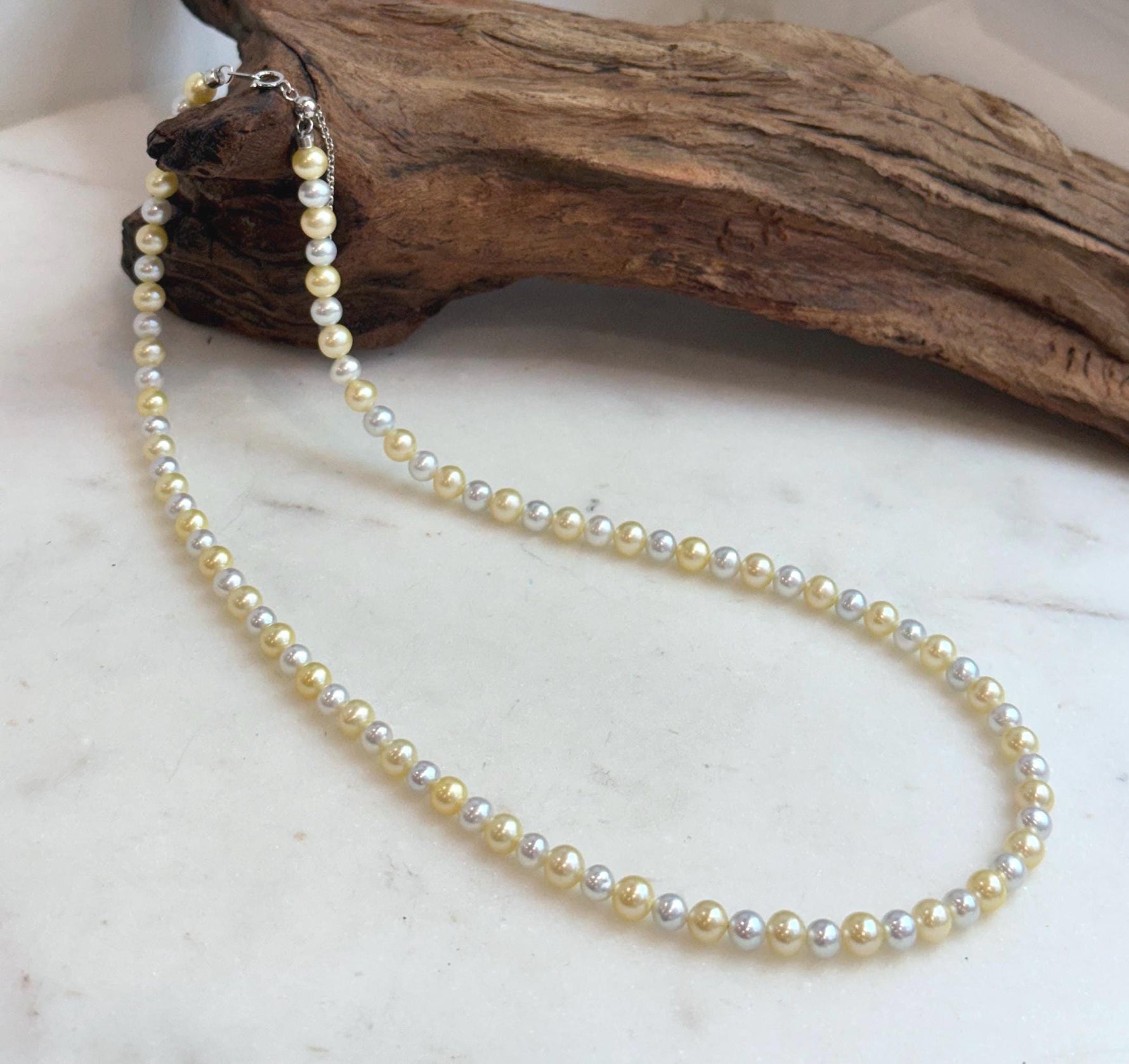 Golden silver pearl necklace finished with an S925 sterling silver clasp.