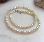 Small freshwater pearl necklace with beautiful shine and delicate graduated pearl sizes.