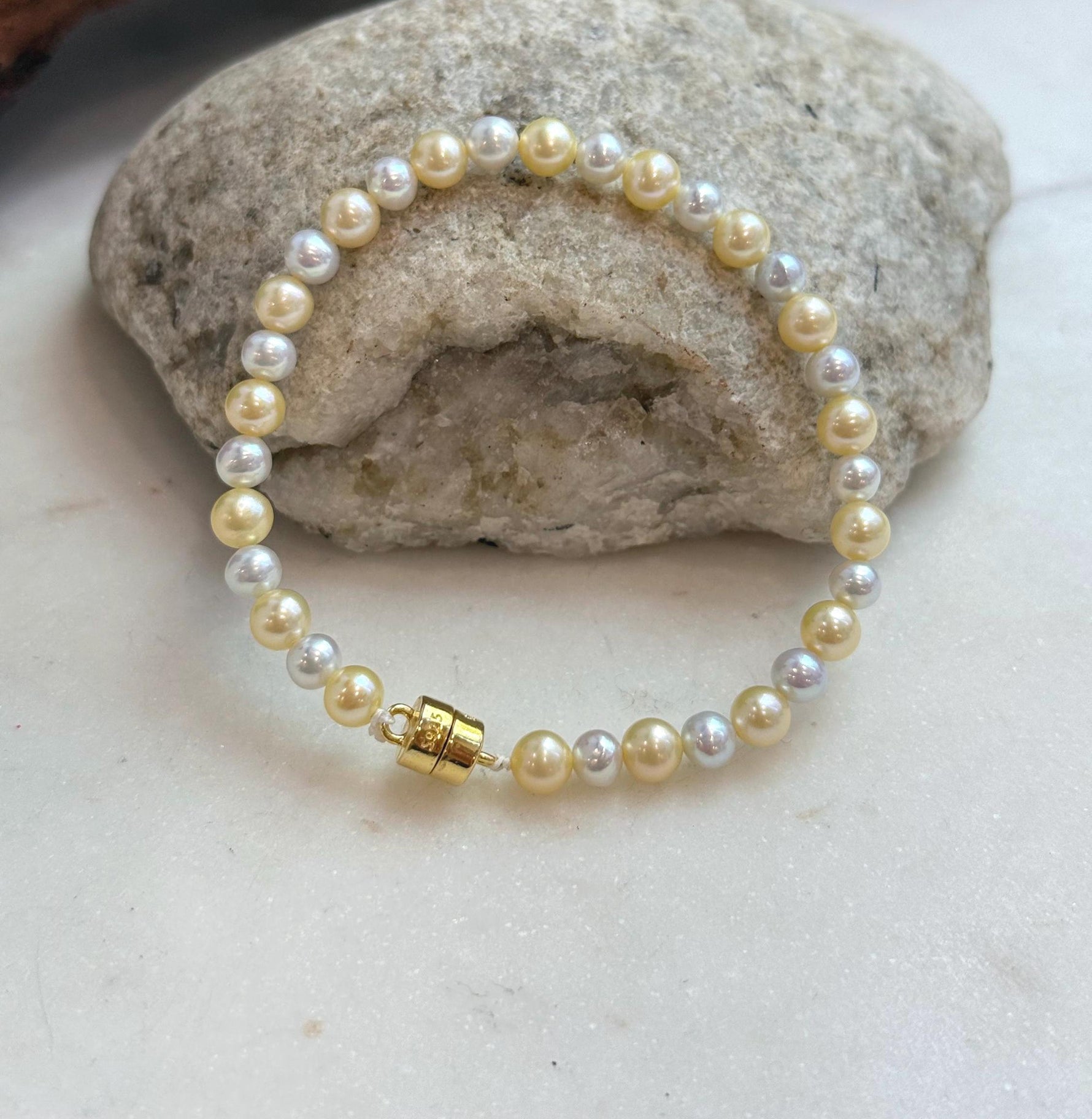 Close-up of 4.3–5.5mm freshwater pearls with beautiful golden silver tones.