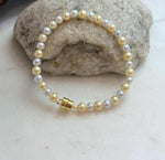 Golden silver genuine pearl bracelet featuring 4.3–5.5mm freshwater pearls.