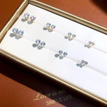 Elegant round moissanite stud earrings crafted from solid 18K yellow gold with timeless six-prong settings.