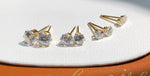 Close-up of brilliant round moissanite earrings crafted in Au750 solid 18K yellow gold with secure 6-prong settings.