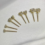 4mm round moissanite stud earrings with classic 4-prong solid 14K gold settings.