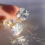 Solid 14K gold moissanite earrings featuring sparkling Asscher cut stones for everyday fine jewelry.
