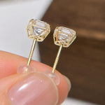 Clear square moissanite stud earrings featuring brilliant sparkle and solid 14K gold settings.