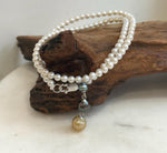 White pearl necklace featuring a 4cm dangling pendant with three colorful genuine pearls.