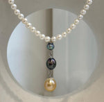 Classic white pearl strand with a unique 5.9–9.5mm triple pearl drop pendant.