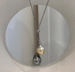 Elegant two pearl pendant chain set with contrasting golden and dark Tahitian saltwater ocean pearls.