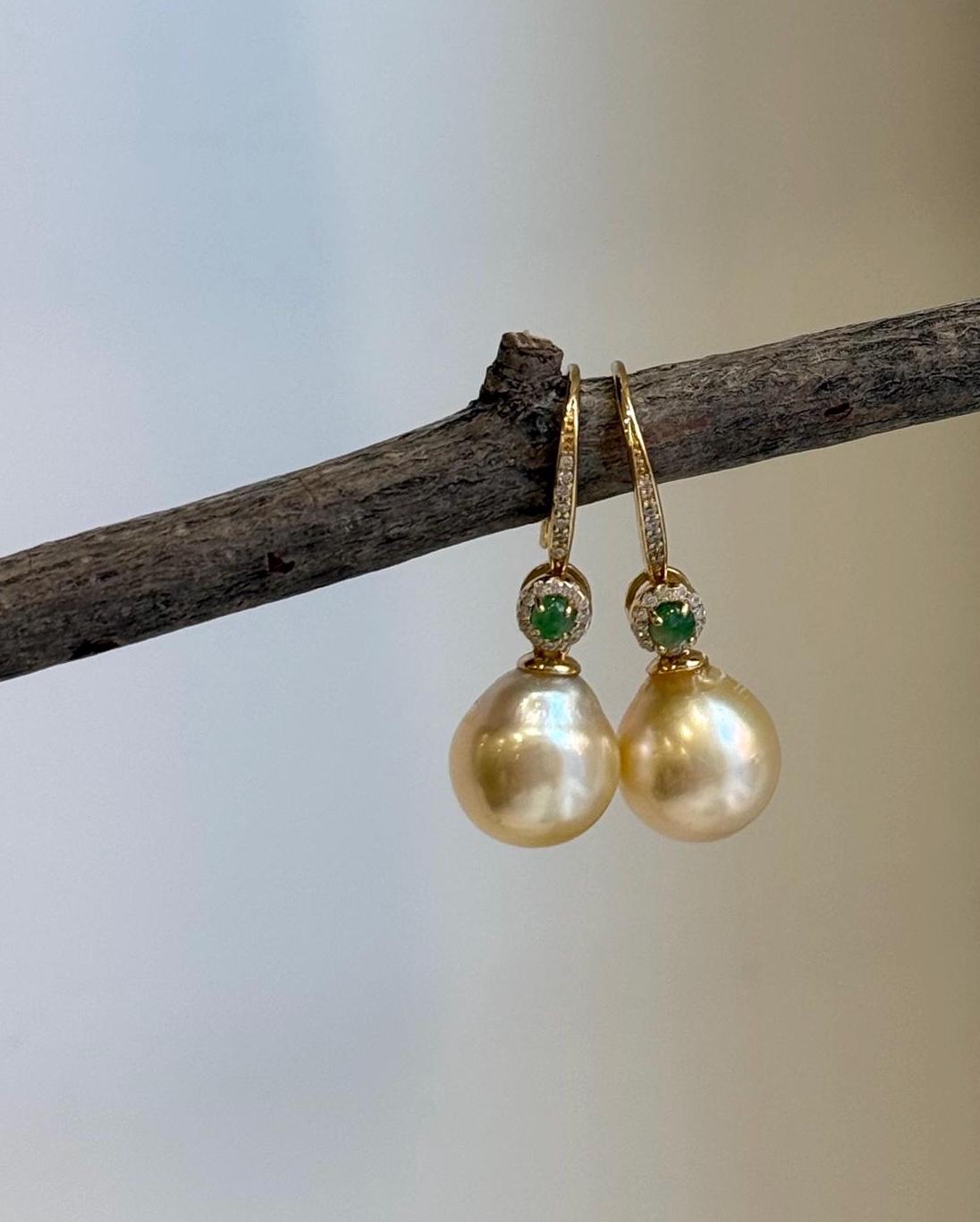 Genuine saltwater pearl earrings with rare ultra gold South Sea pearls and elegant hook design.