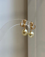 Luxury South Sea ultra gold pearl cat earrings with beautiful round saltwater pearls and brilliant luster.
