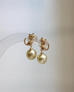 Cute cat pearl earrings with 9.2mm South Sea saltwater pearls, perfect for pearl jewelry lovers and cat lovers.