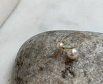 Luxury 18K gold pearl ring showcasing a lustrous Japanese Akoya saltwater pearl in a delicate adjustable engagement ring design.