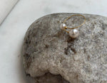 Fine jewelry Akoya saltwater pearl ring with a lustrous ocean pearl and solid G750 18K gold adjustable setting.
