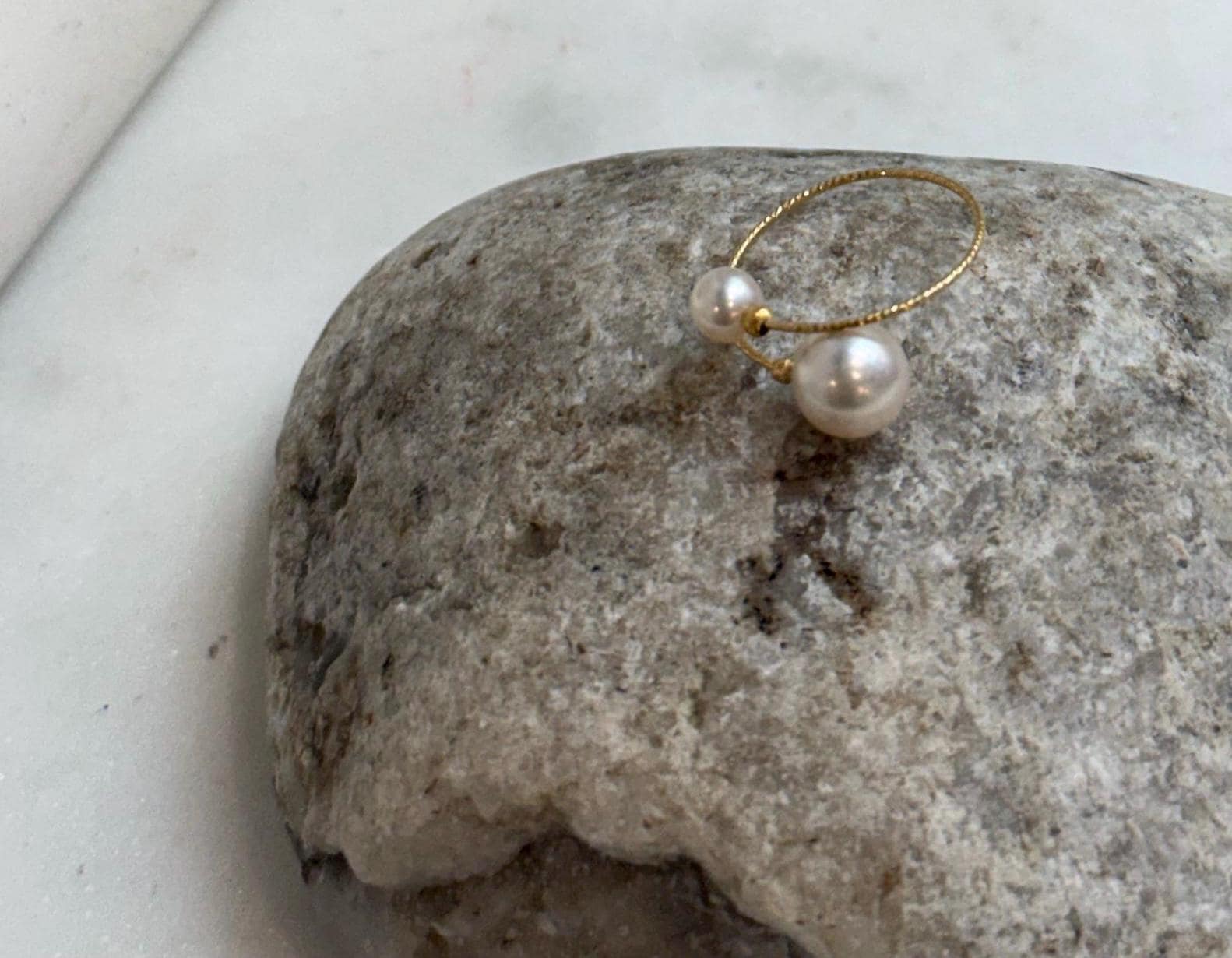 Fine jewelry Akoya saltwater pearl ring with a lustrous ocean pearl and solid G750 18K gold adjustable setting.