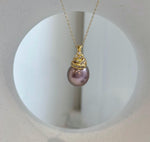 Elly’s 12.9mm Edison metallic lavender rose pearl pendant with extreme mirror luster