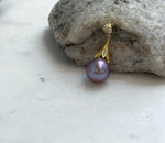 Natural freshwater Edison pearl pendant featuring rich lavender purple iridescence