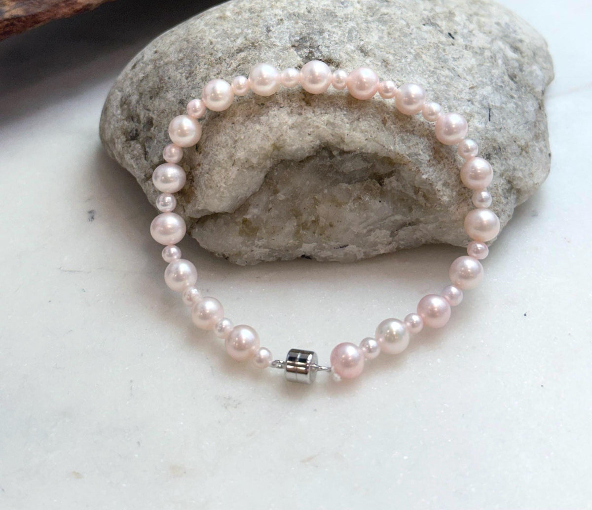 Elegant pale pink pearl jewelry featuring genuine freshwater pearls with clean surfaces and luminous luster.