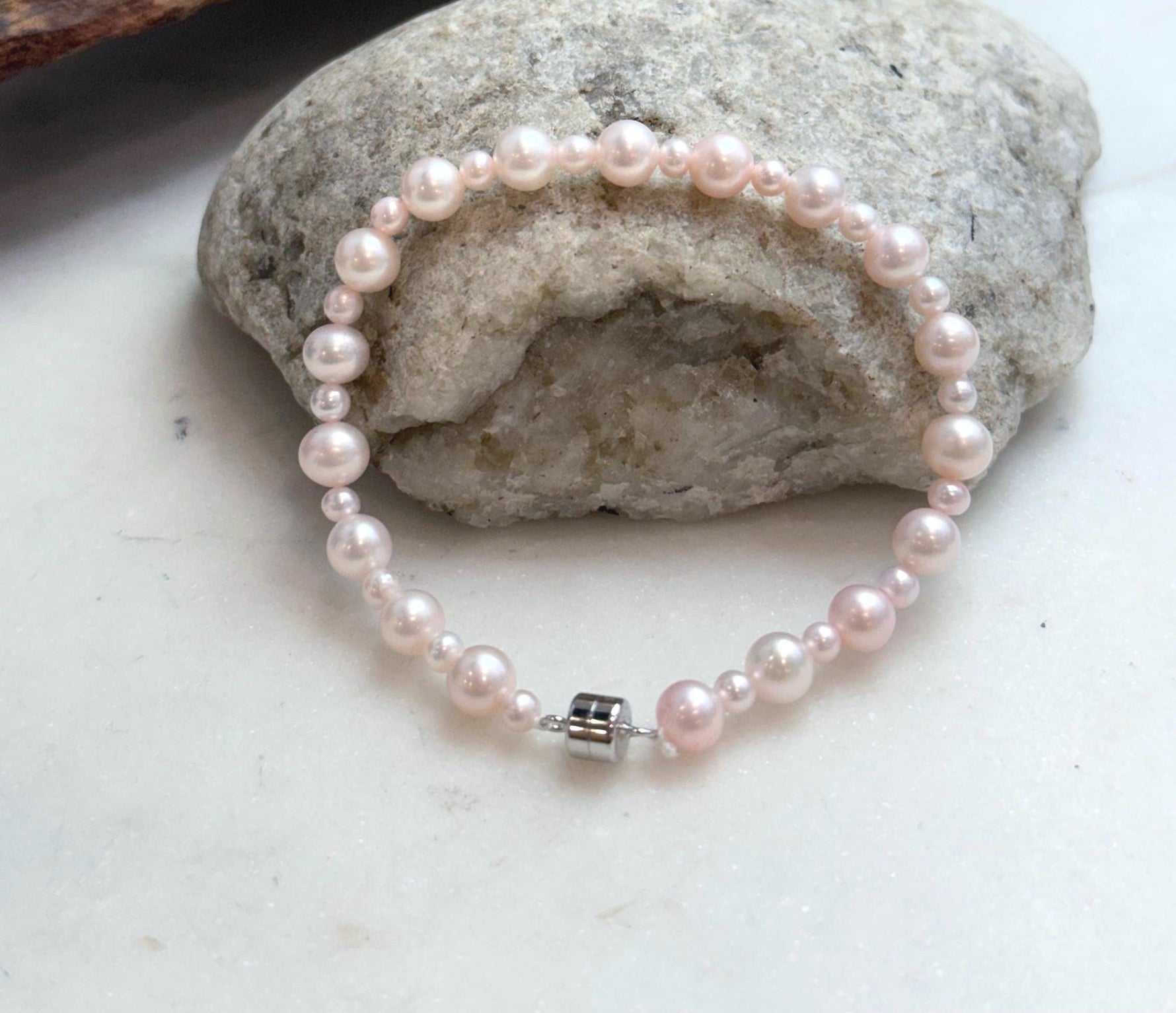 Elegant pale pink pearl jewelry featuring genuine freshwater pearls with clean surfaces and luminous luster.