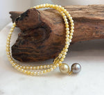 Unique multicolor pearl pendant necklace featuring genuine saltwater and freshwater pearls.
