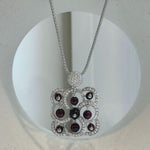 Deep red garnet pendant with 23.6 inch long sterling silver necklace