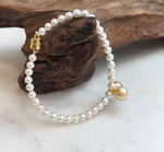 Genuine South Sea golden pearl bracelet featuring two luminous 8.5–8.8mm pearls.