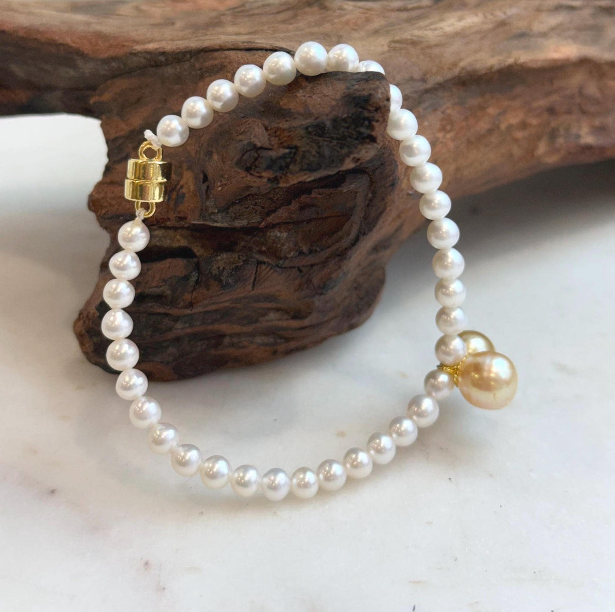Elegant 8.5–8.8mm South Sea golden pearl bracelet crafted with genuine pearls and sterling silver.
