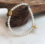 Elegant 8.5–8.8mm South Sea golden pearl bracelet crafted with genuine pearls and sterling silver.